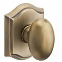 Baldwin Reserve Ellipse Knob With Arched Rosette Matte Brass and Black