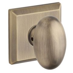 Baldwin Reserve Ellipse Knob With Square Rosette In Matte Brass and Black