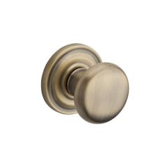 Baldwin Reserve Round Knob With Round Rosette In Matte Brass and Black