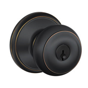 Schlage Georgian Keyed Doorknob in Aged Bronze