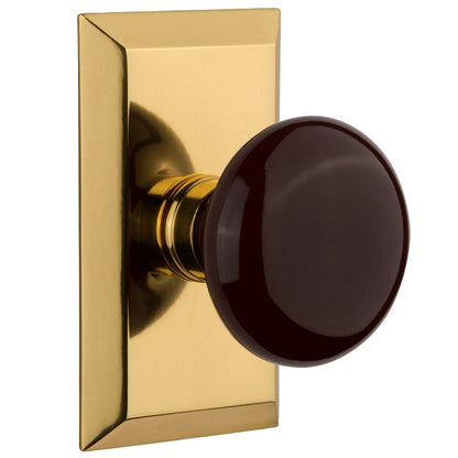 Nostalgic Warehouse Studio Plate with Brown Porcelain Knob - Polished brass