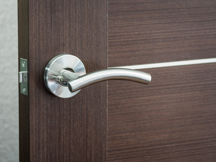 Nova Curve Lever mounted on a door.