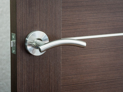 Nova Curve Lever mounted on a door.