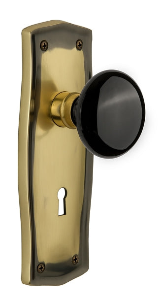 Nostalgic Warehouse Prairie Plate with Black Porcelain Knob Immortise Lock- Antique Brass