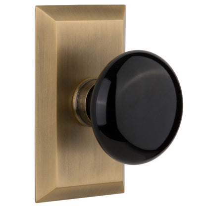 Nostalgic Warehouse Studio Plate with Black Porcelain Knob - Antique brass