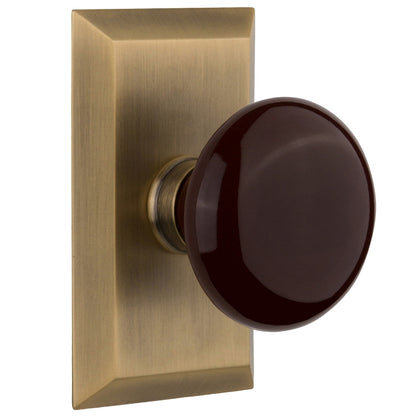 Nostalgic Warehouse Studio Plate with Brown Porcelain Knob - Antique brass