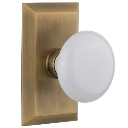 Nostalgic Warehouse Studio Plate with White Porcelain Knob - Antique brass