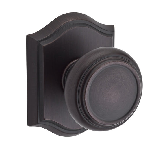 Traditional Knob Shown with Arched Rosette in Venetian Bronze